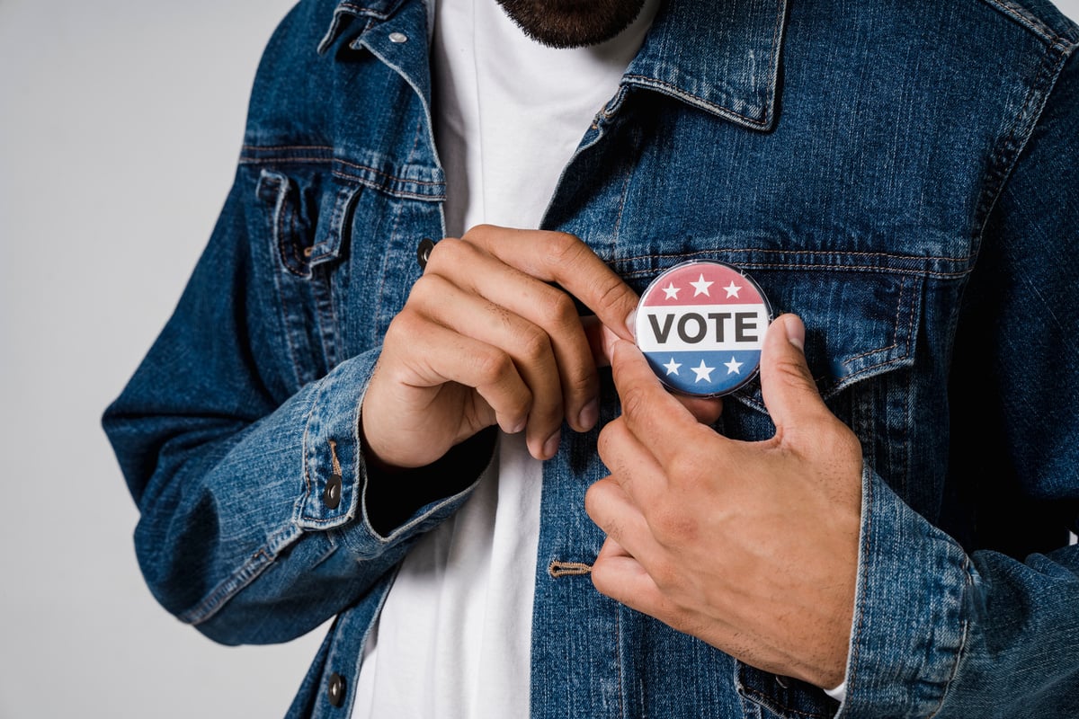 A Person With Pin Back Button on It's Denim Jacket